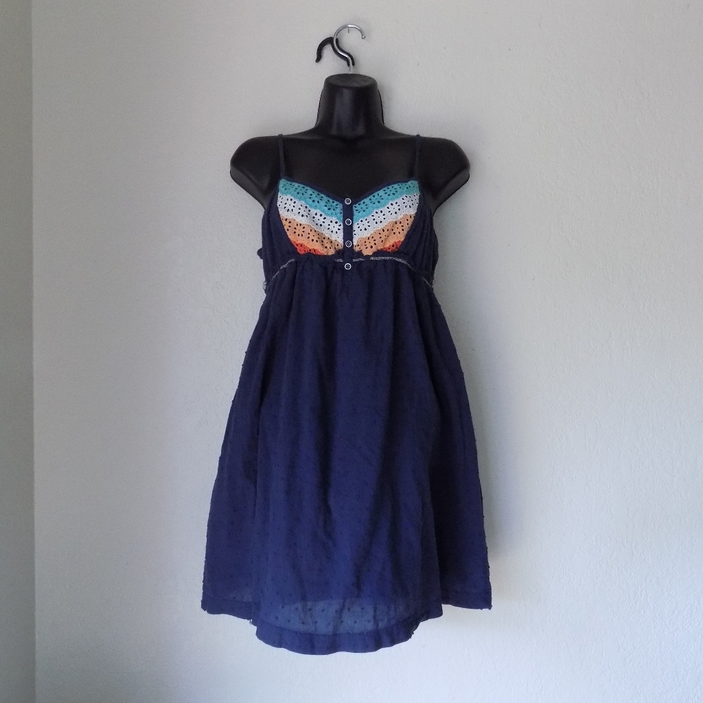 Summer sundress.  Cute detail on chest.